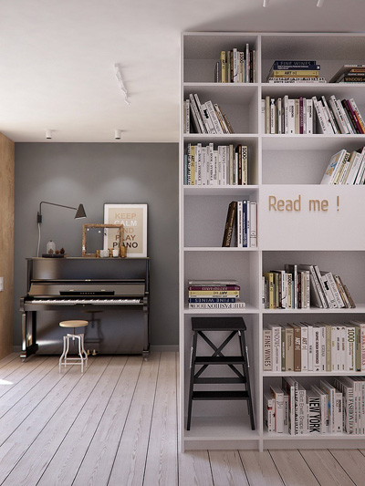 Nơi làm việc và cây đàn piano được xếp ở phòng khách, trong một khu vực nhỏ tĩnh lặng, ngăn cách với xung quanh bởi giá sách có hai mặt